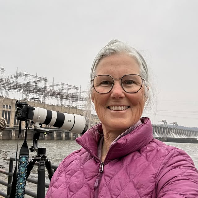 Victoria Mannina with her camera and long lens at Conowingo Dam